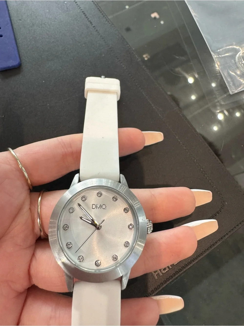 New DMQ Women’s silver tone & white Watch w Crystal Markers and rubber Strap.